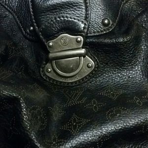 'Solar' Black Mahina leather with perforated monog